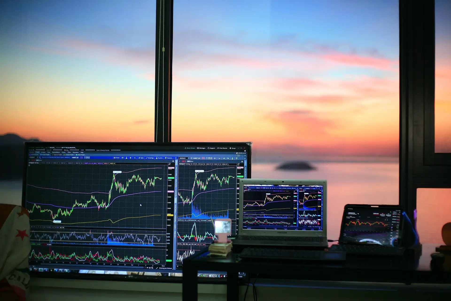 Cryptocurrency coins beside a laptop, illustrating online investment fraud risk