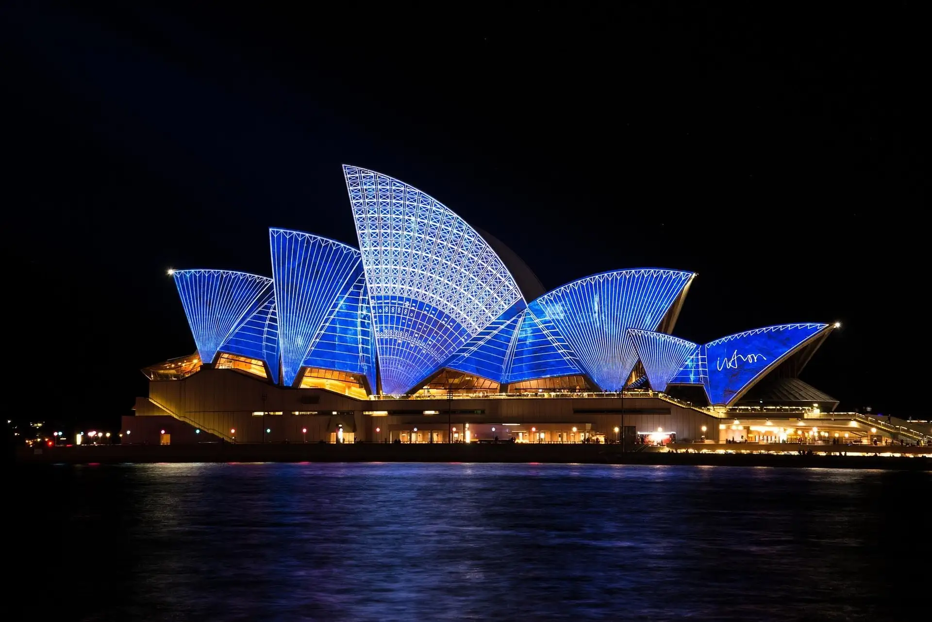Sydney Harbour skyline at dusk with the Harbour Bridge and CBD towers