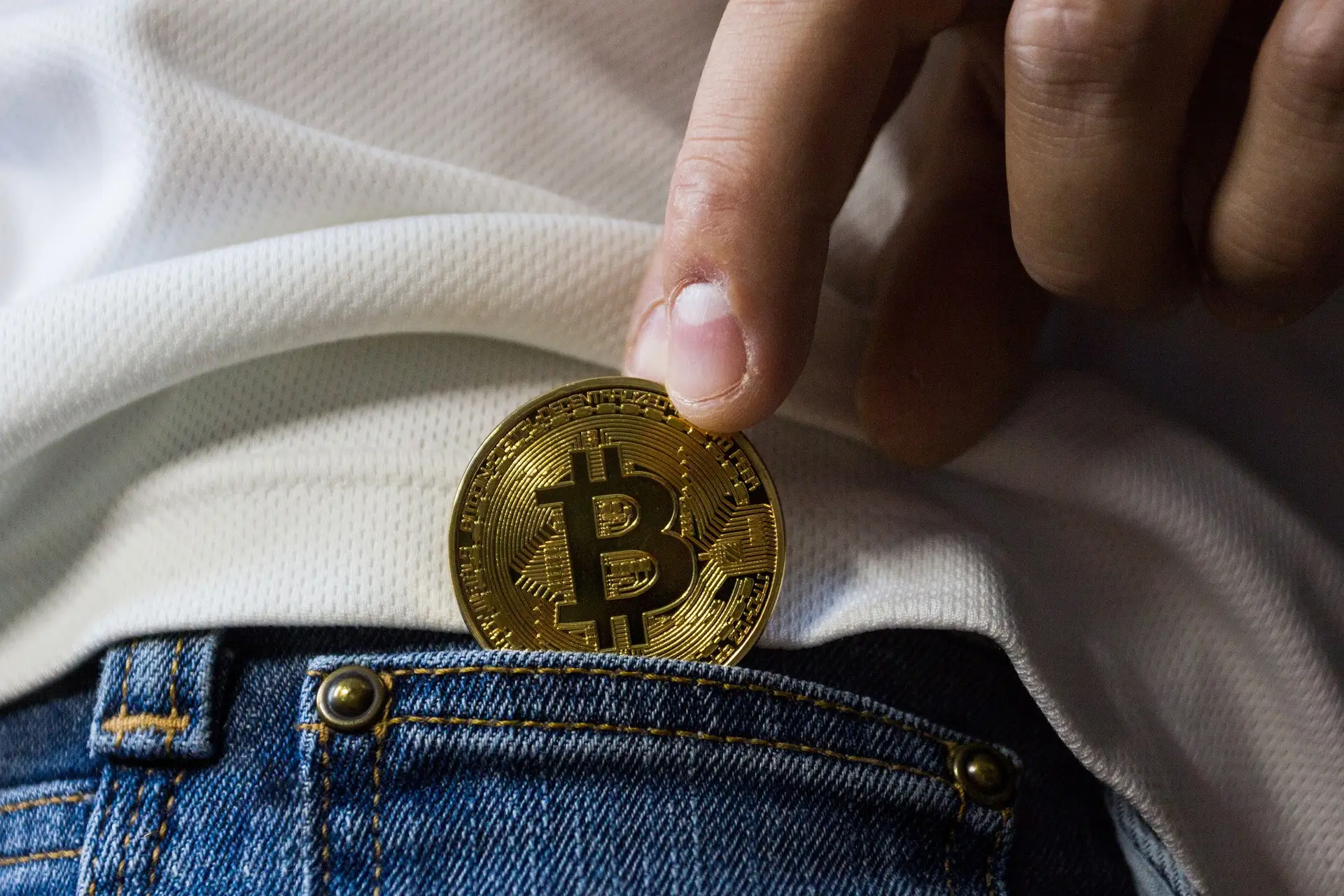 Smartwatch and phone displaying cryptocurrency portfolio data